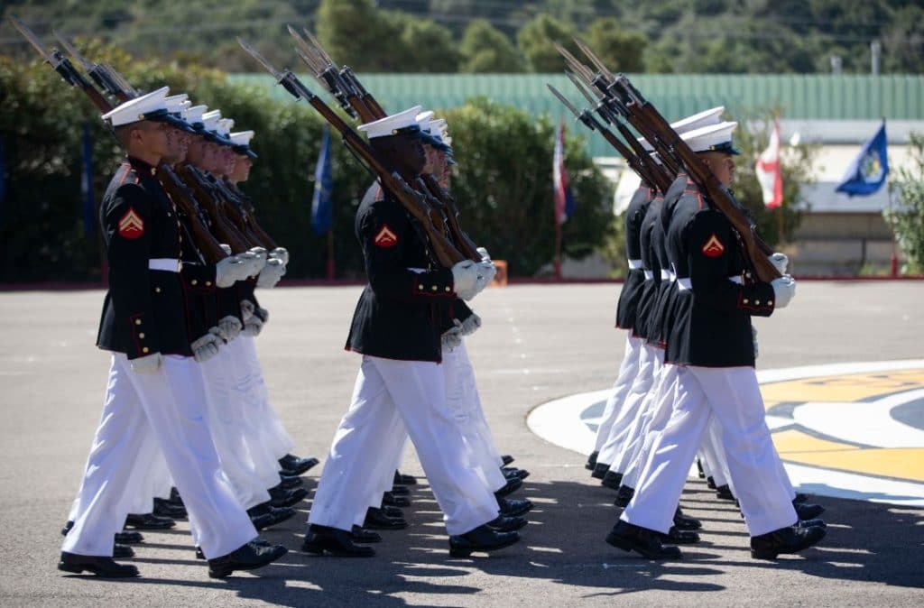 U.S. Marine Corps Silent Drill Platoon marches off the parade deck after their performance at the 52 Area parade deck at the School of Infantry - West on Marine Corps Base Camp Pendleton, California, March 3, 2020. Each year, the Battle Color Detachment, composed of the Silent Drill Platoon, the Marine Corps Color Guard, and the Commandant’s Own, performs in hundreds of ceremonies across the country and around the world. (U.S. Marine Corps photo by Lance Cpl. Andrew Cortez)